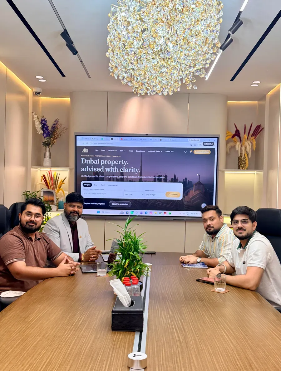 The UpStream team reviewing a client website and strategy in the meeting room